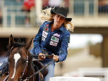 Amberleigh Moore races to the finish during barrel racing at the Calgary Stampede, Saturday July 15, 2017. Leah Hennel/Postmedia