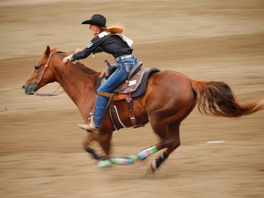 Pamela Capper of Cheney, Washington in the ladies barrel racing event at the Calgary Stampede rodeo. AL CHAREST/POSTMEDIA