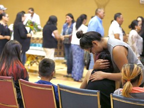 Extended family and friends of Glynnis Fox and Tiffany Ear who were found slain last week in Calgary pack the Bearspaw First Nation Youth Centre for ther memorial in Morley on Monday July 17, 2017. DARREN MAKOWICHUK/Postmedia Network
Darren Makowichuk, DARREN MAKOWICHUK/Postmedia