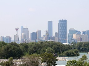 The Calgary skyline is looking a little hazy as smoke from some 230 B.C. wildfires has pushed it's way over the Rockies. Photo taken overlooking Deerfoot Trail and Memorial Drive. Wednesday July 12, 2017 in Calgary, AB. DEAN PILLING/POSTMEDIA