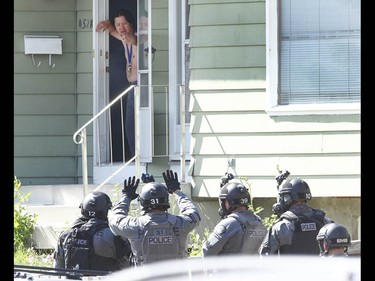Calgary Police take a man into custody after they responded to an incident in 4500 blk of 7 Ave SE related to a stabbing in Calgary on Tuesday July 4, 2017. A stand off with a suspect lasted hours as negotiators dealt with a suspect. Police stormed the house about 5 pm and took one man into custody. Jim Wells//Postmedia