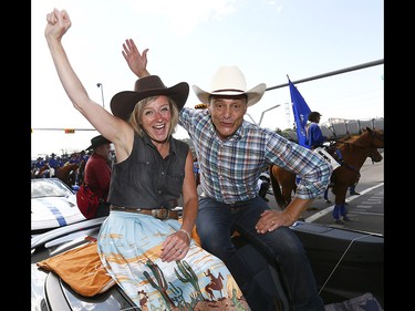 Premier Rachel Notley and Joe Ceci wave as thousands came out to watch the 105th Calgary Stampede Parade in downtown Calgary to kickoff The Greatest Outdoor Show on Earth on Friday July 7, 2017. DARREN MAKOWICHUK/Postmedia Network