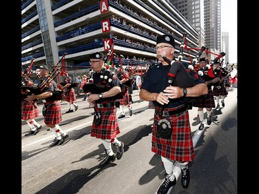 The Calgary Firefighters Associations as thousands came out to watch the 105th Calgary Stampede Parade in downtown Calgary to kickoff The Greatest Outdoor Show on Earth on Friday July 7, 2017. DARREN MAKOWICHUK/Postmedia Network