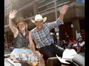 Premier Rachel Notley and Joe Ceci wave as thousands came out to watch the 105th Calgary Stampede Parade in downtown Calgary to kickoff The Greatest Outdoor Show on Earth on Friday July 7, 2017. DARREN MAKOWICHUK/Postmedia Network
