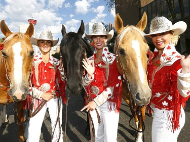 L-R, Stampede Princess Brittany Lloyd, Queen, Meagan Peters and Princess, Lizzie Ryman get ready as thousands came out to watch the 105th Calgary Stampede Parade in downtown Calgary to kickoff The Greatest Outdoor Show on Earth on Friday July 7, 2017. DARREN MAKOWICHUK/Postmedia Network