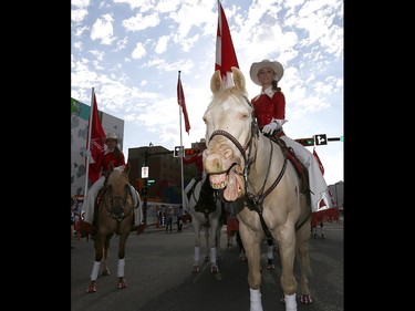 The Calgary Syampede Showriders get ready as thousands came out to watch the 105th Calgary Stampede Parade in downtown Calgary to kickoff The Greatest Outdoor Show on Earth on Friday July 7, 2017. DARREN MAKOWICHUK/Postmedia Network