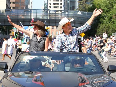 Premier Rachel Notley and Joe Ceci wave as thousands came out to watch the 105th Calgary Stampede Parade in downtown Calgary to kickoff The Greatest Outdoor Show on Earth on Friday July 7, 2017. DARREN MAKOWICHUK/Postmedia Network