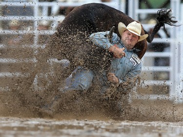 Kyle Irwin from Robertsdale, Arizona competes in the steer wrestling event on day 5 of the Calgary Stampede rodeo, Tuesday  July 11, 2017. GAVIN YOUNG/POSTMEDIA