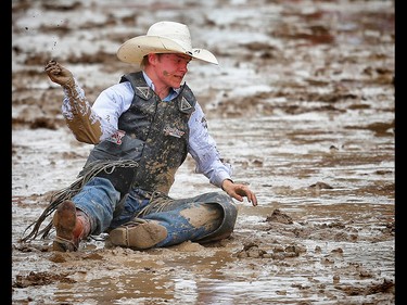 Fox Creek, Alberta cowboy Hunter Sawley  is tossed off a horse named Yellow Coconut during the novice saddle bronc event at the Calgary Stampede rodeo. AL CHAREST/POSTMEDIA