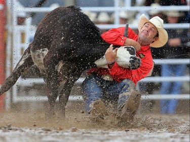 Bray Armes from Gruver Texas had a time of 3.7 win the steer wrestling event at the Calgary Stampede rodeo, Tuesday  July 11, 2017. GAVIN YOUNG/POSTMEDIA