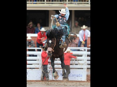 Jacobs Crawley from Boerne Texas rode Spanish Pair to a 86.50 to win the saddlebronc event at the Calgary Stampede rodeo, Tuesday  July 11, 2017. GAVIN YOUNG/POSTMEDIA