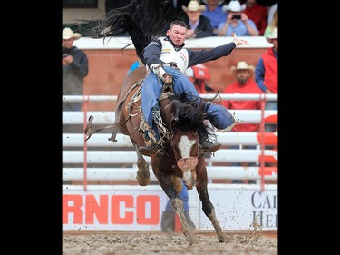 Steven Peebles from Redmond Oregon scored a 90.50 on Yipee Kibitz to win the bareback event at the Calgary Stampede rodeo, Tuesday  July 11, 2017. GAVIN YOUNG/POSTMEDIA