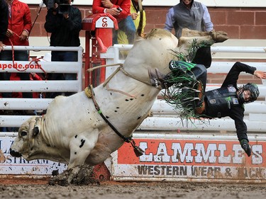 Derek Kolbaba from Walla Walla Wa. rode Blind Spot in the bull riding event at the Calgary Stampede rodeo, Tuesday  July 11, 2017. GAVIN YOUNG/POSTMEDIA