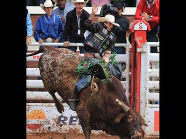 JB Mauney from Statesville NC rode Bomb Shell to win the bull riding event at the Calgary Stampede rodeo, Tuesday  July 11, 2017. GAVIN YOUNG/POSTMEDIA
