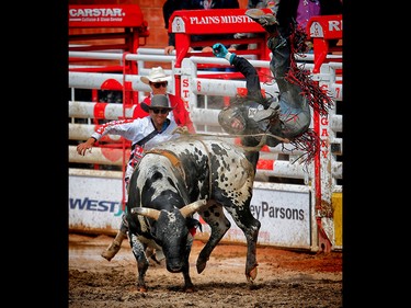 DeWinton, Albera bull rider Brock Radford is bucked off a bull called Somethin' Cool during the Calgary Stampede rodeo. AL CHAREST/POSTMEDIA