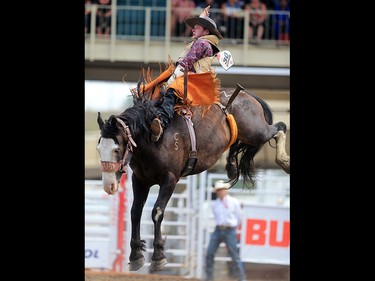 Kyle Bloomquist from Raymond Minnesota Saskatchewan rode Zine Dust to a score of 63 in the novice bareback event at the 2017 Calgary Stampede rodeo, Monday July 10, 2017.  GAVIN YOUNG/POSTMEDIA