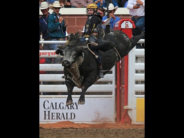 Jess Lockwood from Volberg, Montana won the bull riding event riding Blue Stone to a score of 90.50 on day 4 of the 2017 Calgary Stampede rodeo, Monday July 10, 2017.  GAVIN YOUNG/POSTMEDIA