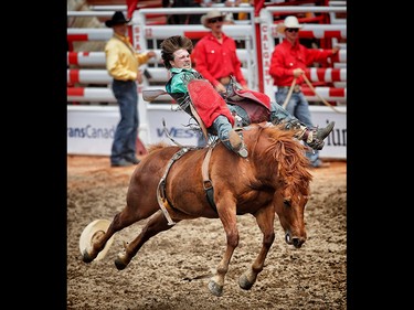 Connor Hamilton, rides a horse called Zero Night to a score of  69 points in the novice bareback at the Calgary Stampede rodeo.