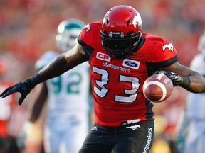 Calgary Stampeders celebrates Jerome Messam after his touchdown against the Saskatchewan Roughriders during CFL football on Saturday.