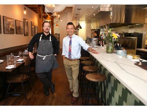 Jason Barton-Browne, Executive Chef (L) and James Hoan Nguyen, General Manager pose at the Hayloft Restaurant in Airdrie.