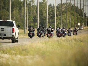Hells Angels members ride along 84 Street SE south of 17 Avenue towards the Hells Angels' clubhouse on Friday, July 21, 2017 in Calgary, Alta. About 500 Hells Angels members are in Calgary for the weekend to celebrate 20 years of the Calgary chapter of the gang and Calgary Police Service and RCMP are regularly patrolling the area. Britton Ledingham/Postmedia Network

Handout Not For Resale
Britton Ledingham, Britton Ledingham/Airdrie Echo