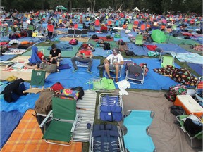 A sea of blankets and tarps mark out claimed areas in front of the main stage at the Calgary Folk Music Festival at Prince's Island in 2014. This year's festival starts on Thursday.
