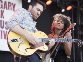 Birds of Chicago's Joel Schwartz and Allison Russell jam on the second day of the Calgary Folk Music Festival at Prince's Island Park on Friday.