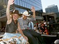 Premier Rachel Notley and Joe Ceci wave as thousands came out to watch the 105th Calgary Stampede Parade in downtown Calgary to kickoff The Greatest Outdoor Show on Earth on Friday July 7, 2017. DARREN MAKOWICHUK/Postmedia Network