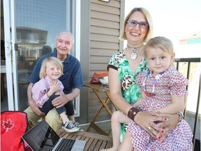 Tania Ventura with her children AJ and Tiffany, and father Eustachio Ventura at their new home in Heartland in Cochrane.