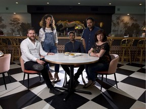 Cody Willis, owner, left, Maya Gohill, owner and designer, Rene Bhullar, chef, Shovik Sengupta, owner and Amber Anderson, owner, pose for a photo at their restaurant Calcutta Cricket Club in Calgary.