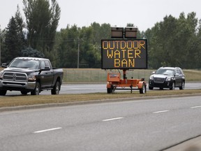 A water ban sign in Okotoks on Tuesday August 8, 2017. Leah Hennel/Postmedia