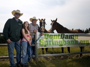 John Robinson, long time rancher in the Springbank area, right with his son Ryan and grand-daughter Samantha, 11, are upset about the proposed dry dam that will ruin their ranch.