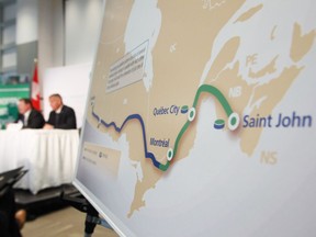 TransCanada Corp. president and CEO Russ Girling, right, speaks at the company's announcement of the Energy East pipeline project in 2013.