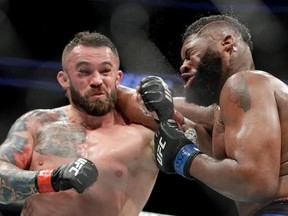 File- This July 8, 2017, file photo shows Daniel Omielanczuk, left, hitting Curtis Blaydes in a heavyweight mixed martial arts bout at UFC 213, in Las Vegas. The UFC is set to use a technology platform that could enhance the way fans watch fights. The world&#039;s leading mixed martial arts promotion has reached a partnership with Heed. The joint venture between WME-IMG and AGT International wants to change the way fans connect with sports at home or at a live event through sensor-measured data.(AP P