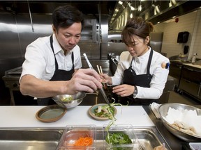 Executive chef Jinhee Lee and chef/owner Duncan Ly prep a pair of imperial roll dishes at Foreign Concept. Eat the restaurant's prix-fixe menu as a part of Summer Feast starting this weekend.