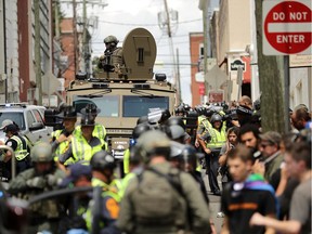 Violent Clashes Erupt at "Unite The Right" Rally In Charlottesville

CHARLOTTESVILLE, VA - AUGUST 12:  A Virginia State Police officer in riot gear keeps watch from the top of an armored vehicle after car plowed through a crowd of counter-demonstrators marching through the downtown shopping district August 12, 2017 in Charlottesville, Virginia. The care plowed through the crowed following the shutdown of the Unite the Right rally by police after white nationalists, neo-Nazis and members of the "alt-right" and counter-protesters clashed near Lee Park, where a statue of Confederate General Robert E. Lee is slated to be removed.  (Photo by Chip Somodevilla/Getty Images)
Chip Somodevilla, Getty Images