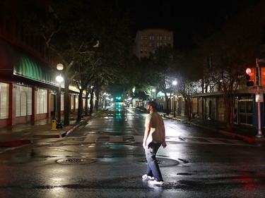 CORPUS CHRISTI, TX - AUGUST 26:  A man walks through the streets after the passing of Hurricane Harvey on August 26, 2017 in Corpus Christi, Texas.  Hurricane Harvey had intensified into a hurricane and hit the Texas coast as damage is being assessed.  (Photo by Joe Raedle/Getty Images)