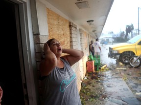 Daisy Graham reacts to the news that a friend of hers may still be in an apartment that  was destroyed by Hurricane Harvey on August 26, 2017 in Rockport, Texas.