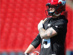 Calgary Stampeders QB Bo Levi Mitchell puts his hand on his throwing shoulder during practice. The Stamps will host the Toronto Argonauts this weekend. Al Charest/Postmedia

Calgary Stampeders Football CFL Postmedia Calgary.