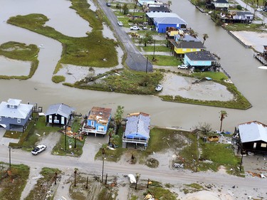 This aerial photo shows damaged homes in the wake of Hurricane Harvey, Monday, Aug. 28, 2017, in Corpus Christi, Texas. Harvey hit the coast as a Category 4 hurricane. (Gabe Hernandez/Corpus Christi Caller-Times via AP) ORG XMIT: TXCOR206