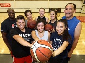 Members of the Elite Calgary women's  Basketball team during practice at the Calgary Central Sportsplex before heading to the World Indigenous Basketball Games in Vancouver with Coaches L-R, Peter Sambu and Lyle Bruno on Thursday August 3, 2017. Darren Makowichuk/Postmedia
