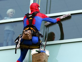 Window-washers dressed as superheroes descended on the Alberta Children's Hospital in Calgary for the second year in a row bringing joy to sick kids on Thursday August 17, 2017. Darren Makowichuk/Postmedia