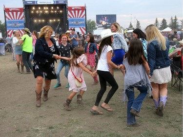 Kids dance as High Valley performs on day three of the Country Thunder music festival held at Prairie Winds Park on Sunday, August 20, 2017. Dean Pilling/Postmedia