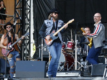 Clayton Bellamy, Jason McCoy and  Chris Byrne of The Road Hammers perform on day two of the Country Thunder music festival held at Prairie Winds Park Saturday, August 19, 2017. Dean Pilling/Postmedia
