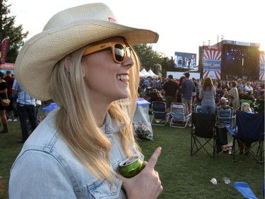 Hannah Nolan smiles as Randy Houser performs on day two of the Country Thunder music festival held at Prairie Winds Park Saturday, August 19, 2017. Dean Pilling/Postmedia