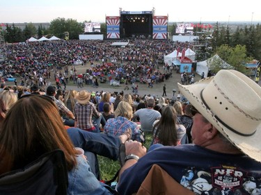 Fans watch from the hill as Joe Nichols performs on day two of the Country Thunder music festival held at Prairie Winds Park Saturday, August 19, 2017. Dean Pilling/Postmedia