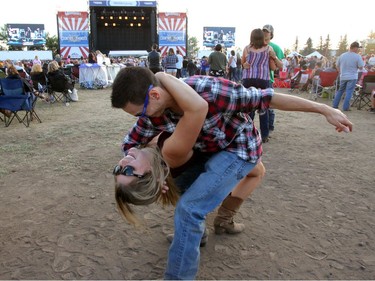 Fans dance as Joe Nichols performs on day two of the Country Thunder music festival held at Prairie Winds Park Saturday, August 19, 2017. Dean Pilling/Postmedia