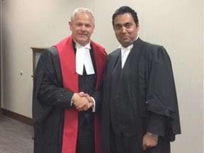 Court of Queen's Bench Judge Willie deWit, left, with lawyer Mohammed Ali in Calgary on Wednesday, August 2, 2017.