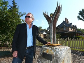 Larry Wasyliw, President of the Fish Creek Restoration Society, poses with a recently acquired piece of art from a Bali-based artist near The Ranche at Fish Creek park in Calgary on Friday, August 11, 2017. Three years after her death, the art displays and installations at the Ranche at Fish Creek have grown. 

Postmedia Calgary Full Full contract in place
Jim Wells Jim Wells, JimWells/Postmedia