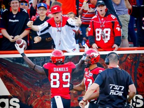 Calgary Stampeders receiver DaVaris Daniels celebrates after his touchdown with teammate Juwan Brescacin against the Toronto Argonauts during CFL football on Saturday, August 26, 2017. Al Charest/Postmedia